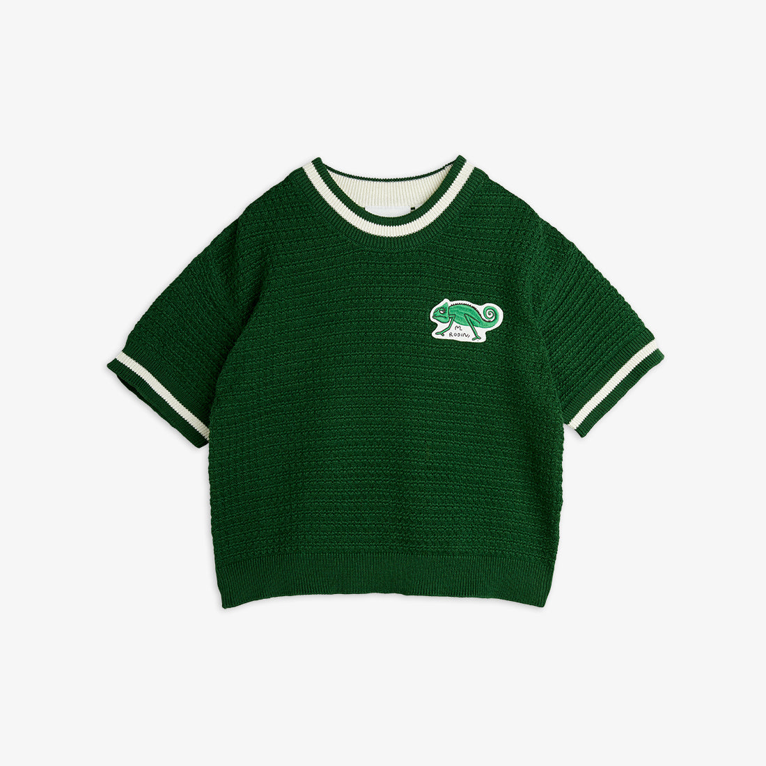 Front view of a green crochet-knit Mini Rodini tee with a chameleon patch and contrast striped trim.