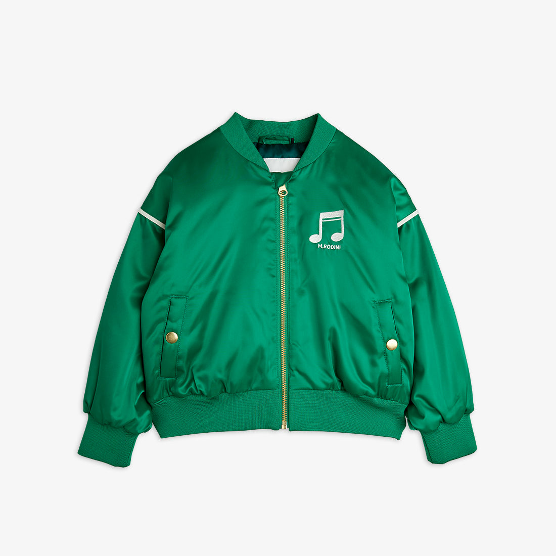 A green satin baseball jacket with ribbed cuffs, hem, and collar. Features a gold zip closure, snap-button pockets, white piping on the sleeves, and an embroidered Mini Rodini musical note logo on the chest.