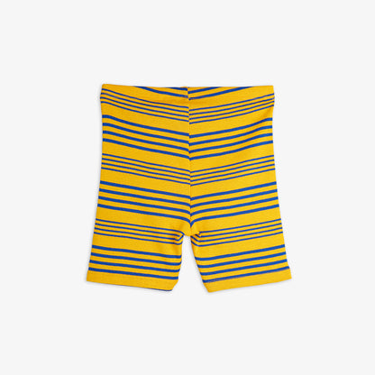 Back view of the Mini Rodini striped bike shorts, showcasing the ribbed texture, elasticated waistband, and blue and black horizontal stripe pattern on a yellow base.