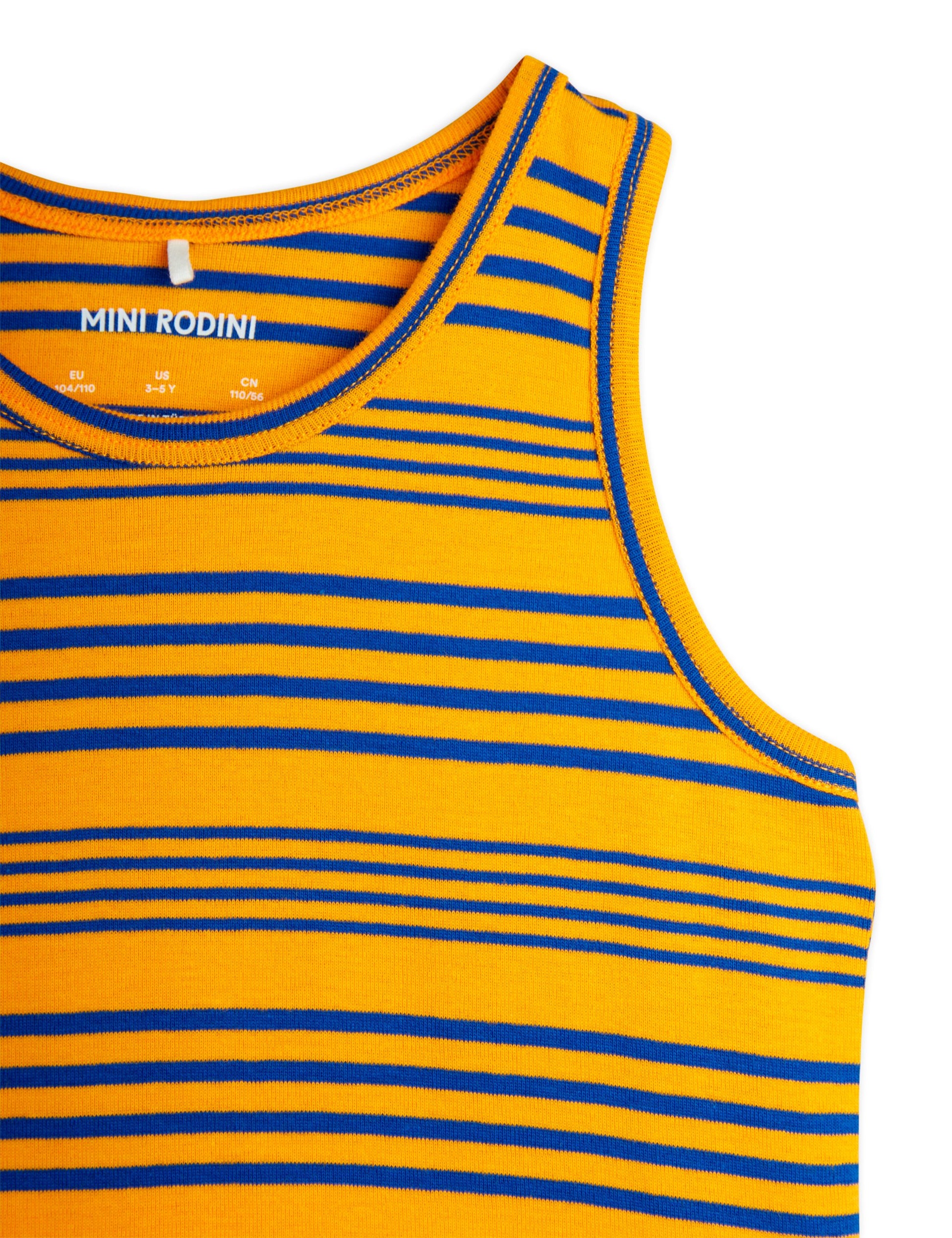 A close-up view of the neckline of the Mini Rodini Stripe Tank, featuring a vibrant yellow base with bold blue horizontal stripes. The ribbed trim and visible brand label add detail to the design.