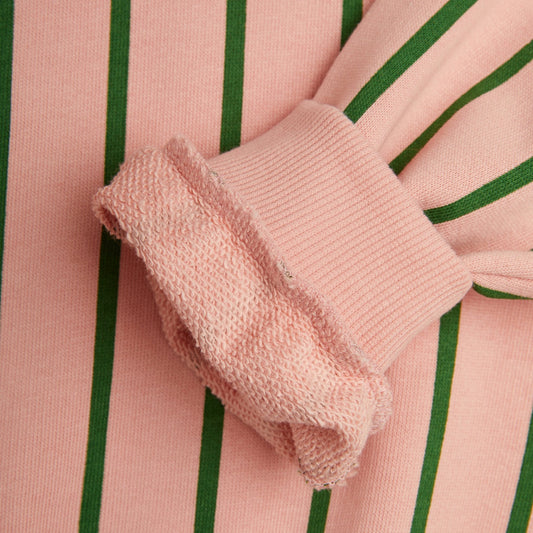 Close-up of the sleeve and cuff of the Mini Rodini Vertical Stripe Sweatshirt in Pink, showing the soft ribbed cuff and plush interior texture.