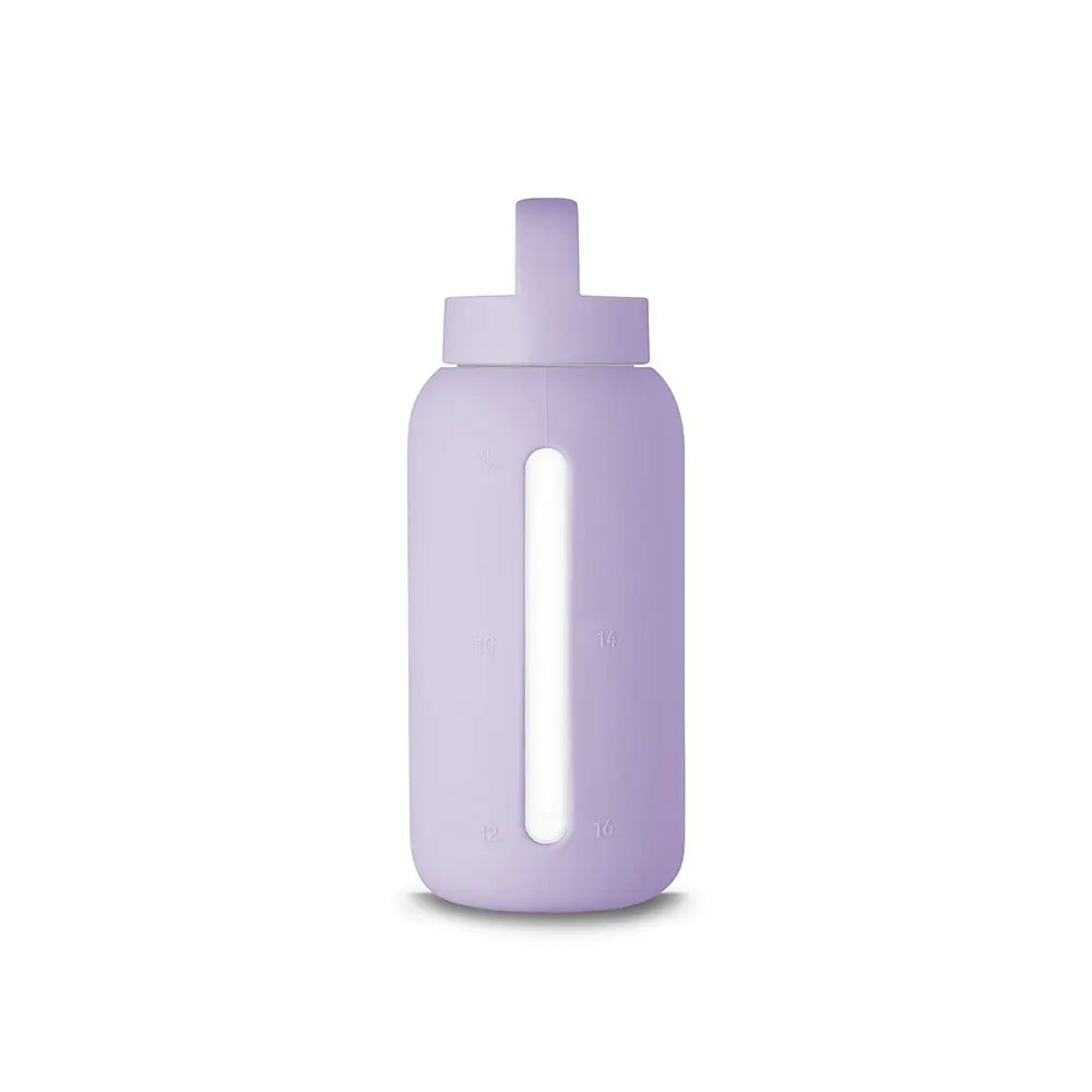 A matte Silicone covered glass bottle, with a window to see the drink on the inside, in a baby Lilac purple colour with a plastic screw top circular lid with a handle