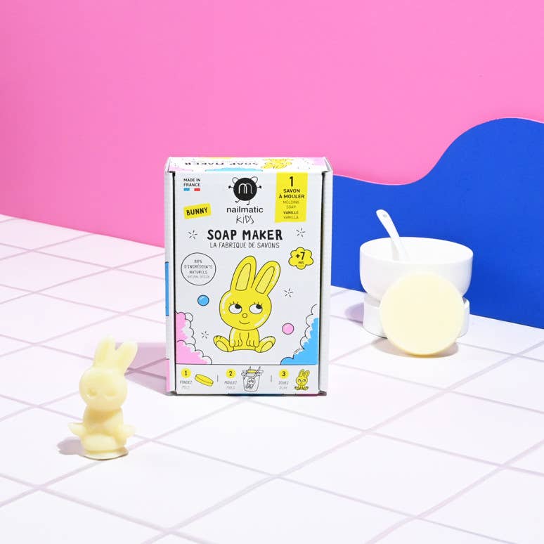 The Nailmatic Bunny Soap Maker DIY Kit, featuring a natural latex mold, vanilla-scented soap, and cardboard spacers for creating a bunny-shaped soap for kids.