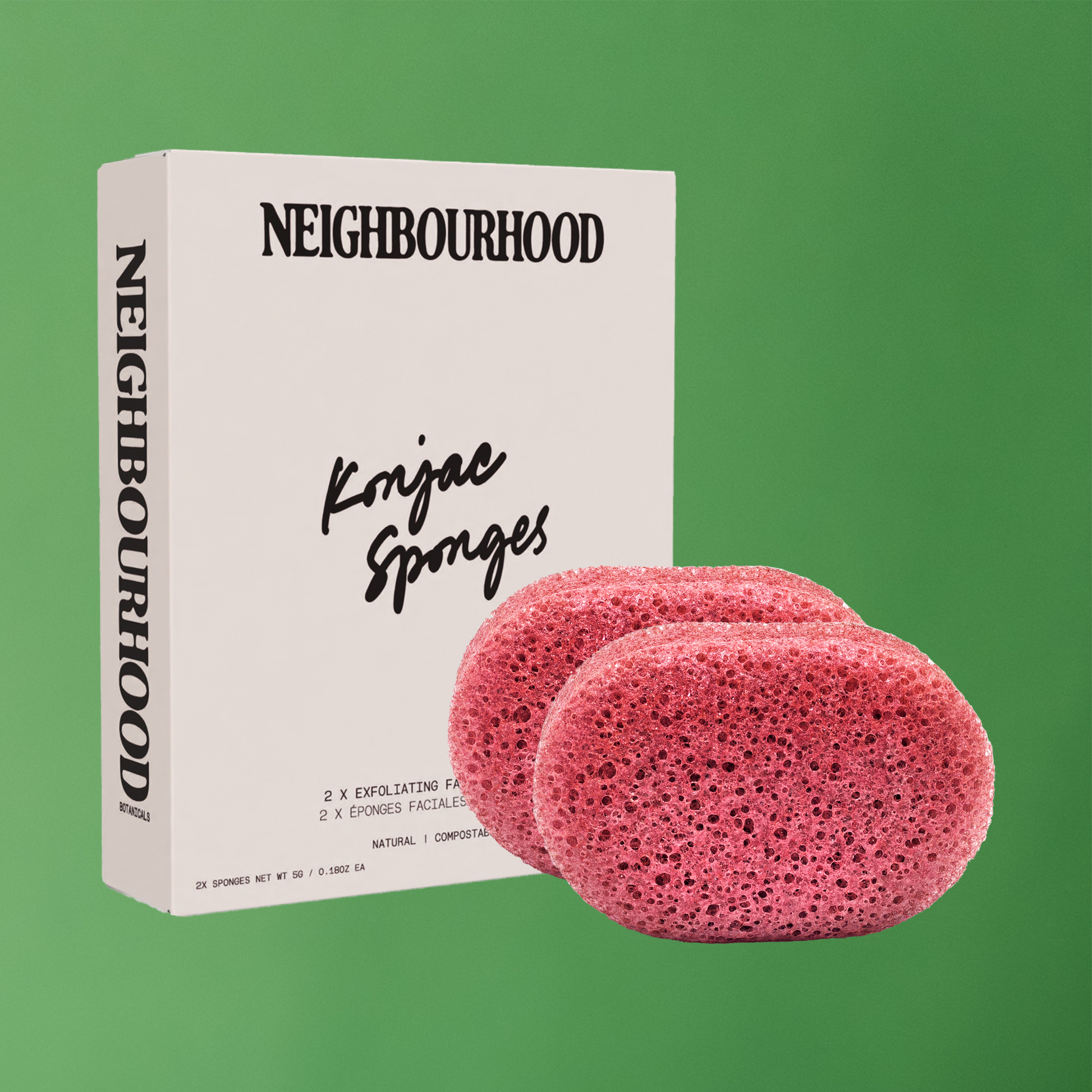 A set of pink/red natural fibre konjac sponges in a white box with black writing, showcasing their sustainable packaging.