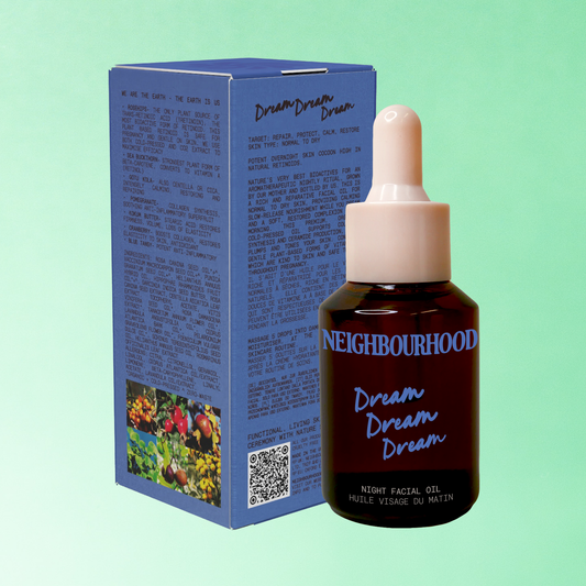 A bottle and box of potent overnight skin cocoon oil, featuring minimalist, natural-toned packaging with a focus on its premium, organic ingredients.