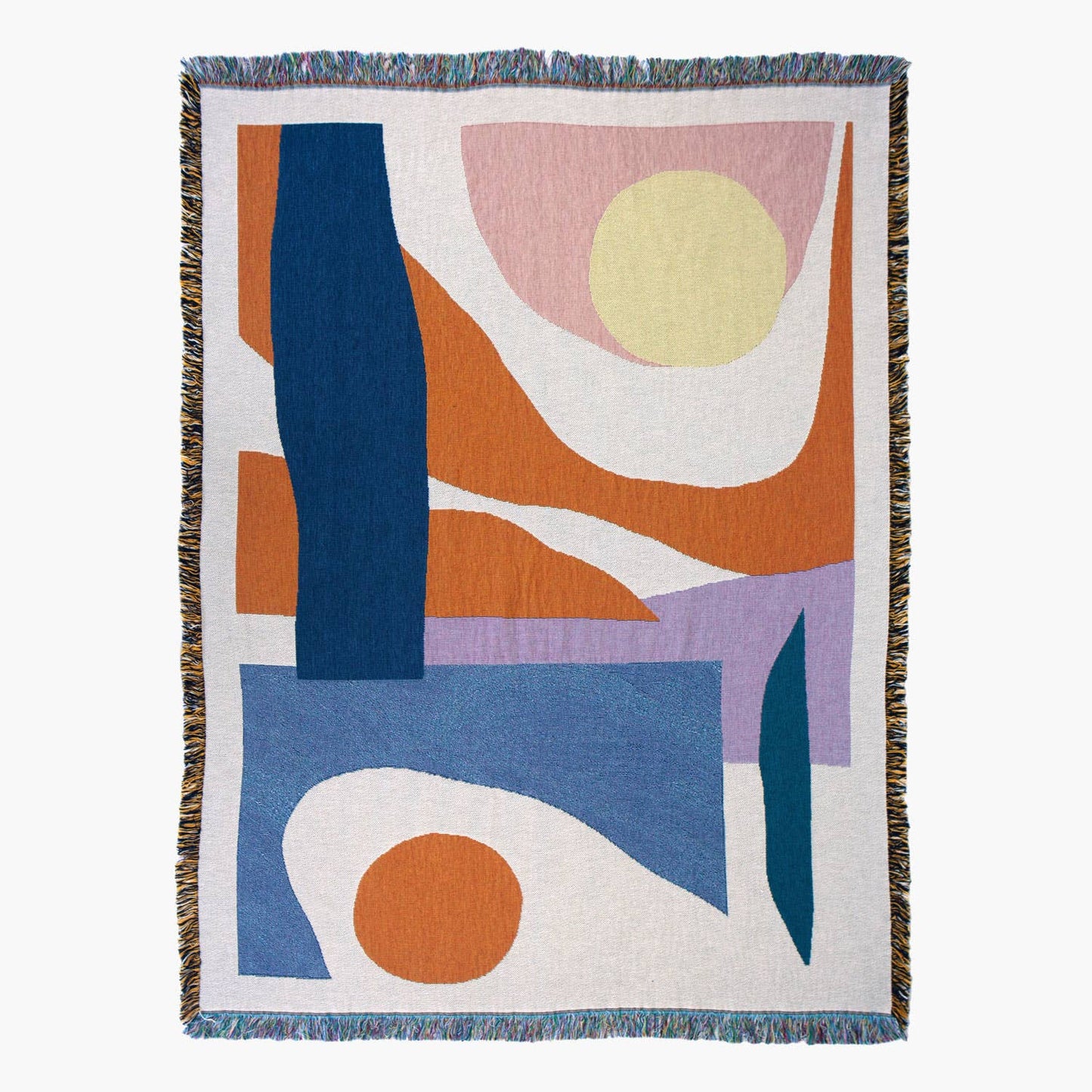 The Slowdown Studio Essien Throw, designed by Noémie Cédille, featuring a bold abstract design with flowing organic shapes in blue, orange, pink, and beige. Woven in the USA from recycled cotton.