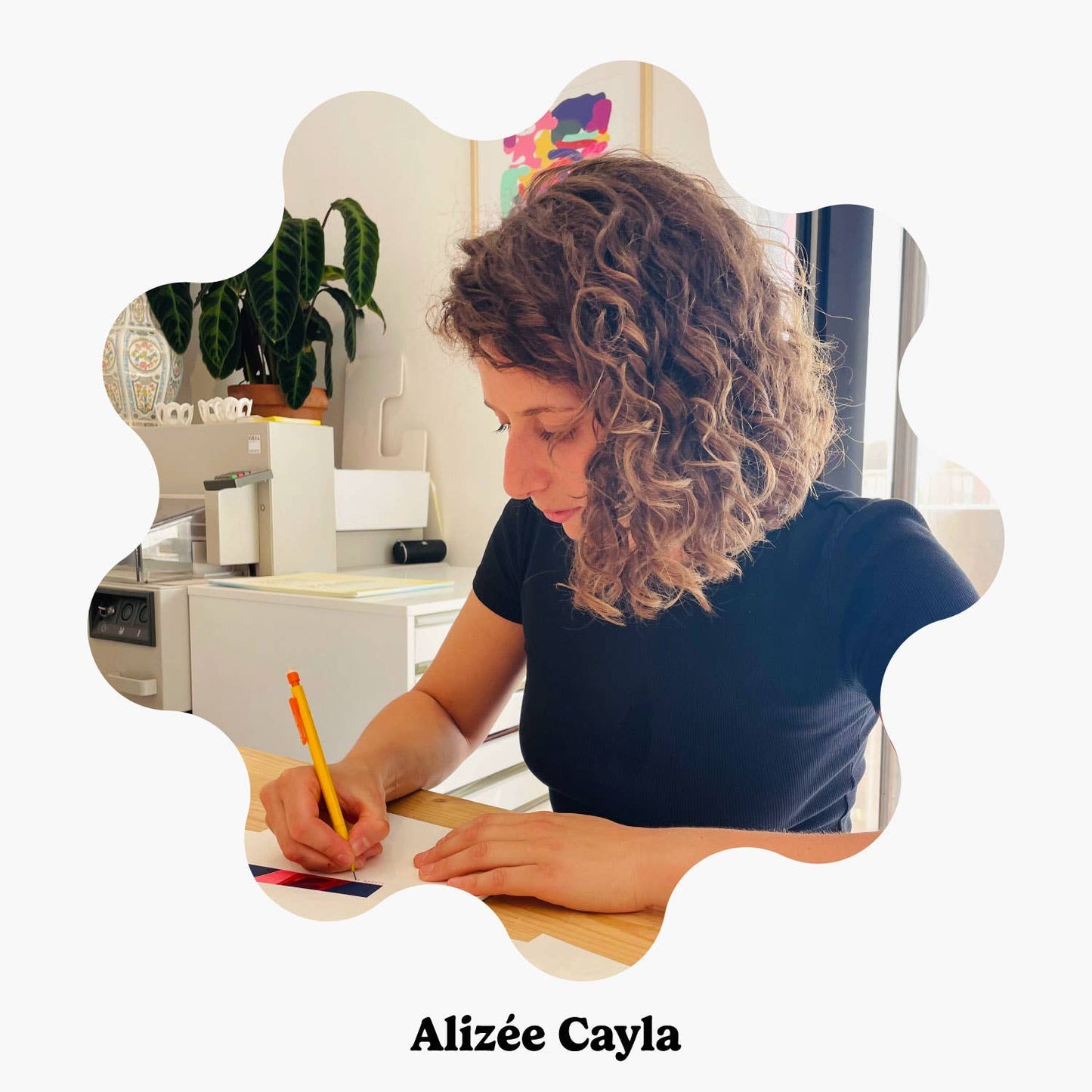 French artist Alizée Cayla sketches at her desk, bringing her signature abstract and organic shapes to life. Her creative process is reflected in the soft, earthy colour palette of the Felix Throw.