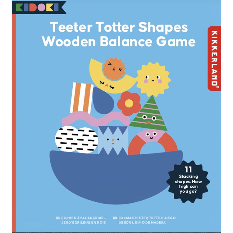 Teeter Totter Shapes Wooden Balance Game packaging. The box features a blue background with an illustration of colourful geometric and character-inspired wooden shapes stacked on a curved base. A label highlights '11 stacking shapes. How high can you go?' The Kidoki and Kikkerland logos are present, with multilingual product descriptions.