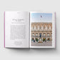 Open book showing a page with text and an image of a building