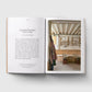 Open book showing a photograph of a pottery studio on the right page with text on the left.