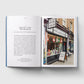 Open book with text and a photograph of Brick Lane Bookshop on a white background