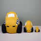 Three knitted taxi toys of different sizes on a neutral background