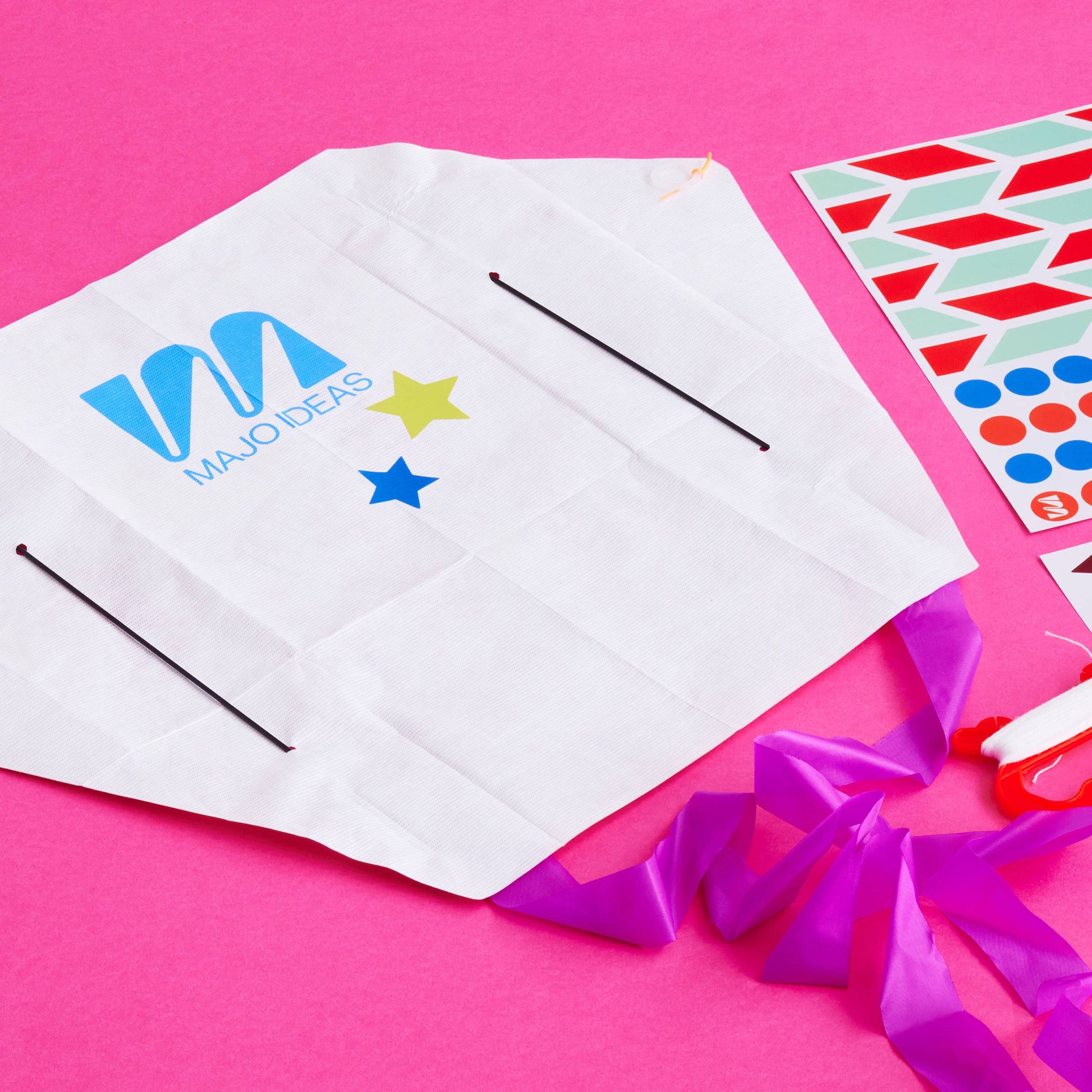 White paper with colourful logos on a pink background