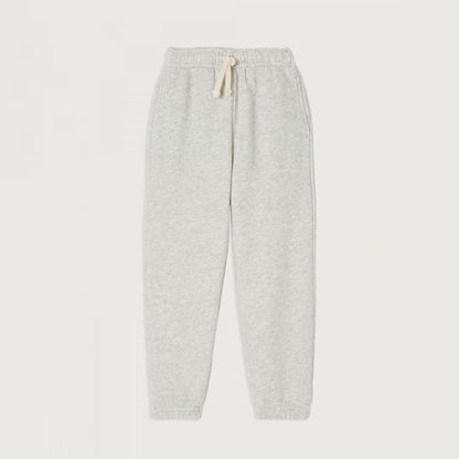 American Vintage Kids Grey Kodytown Joggers featuring an elasticated waistband with a cream drawstring, side pockets, and ribbed cuffs, displayed flat on a light background