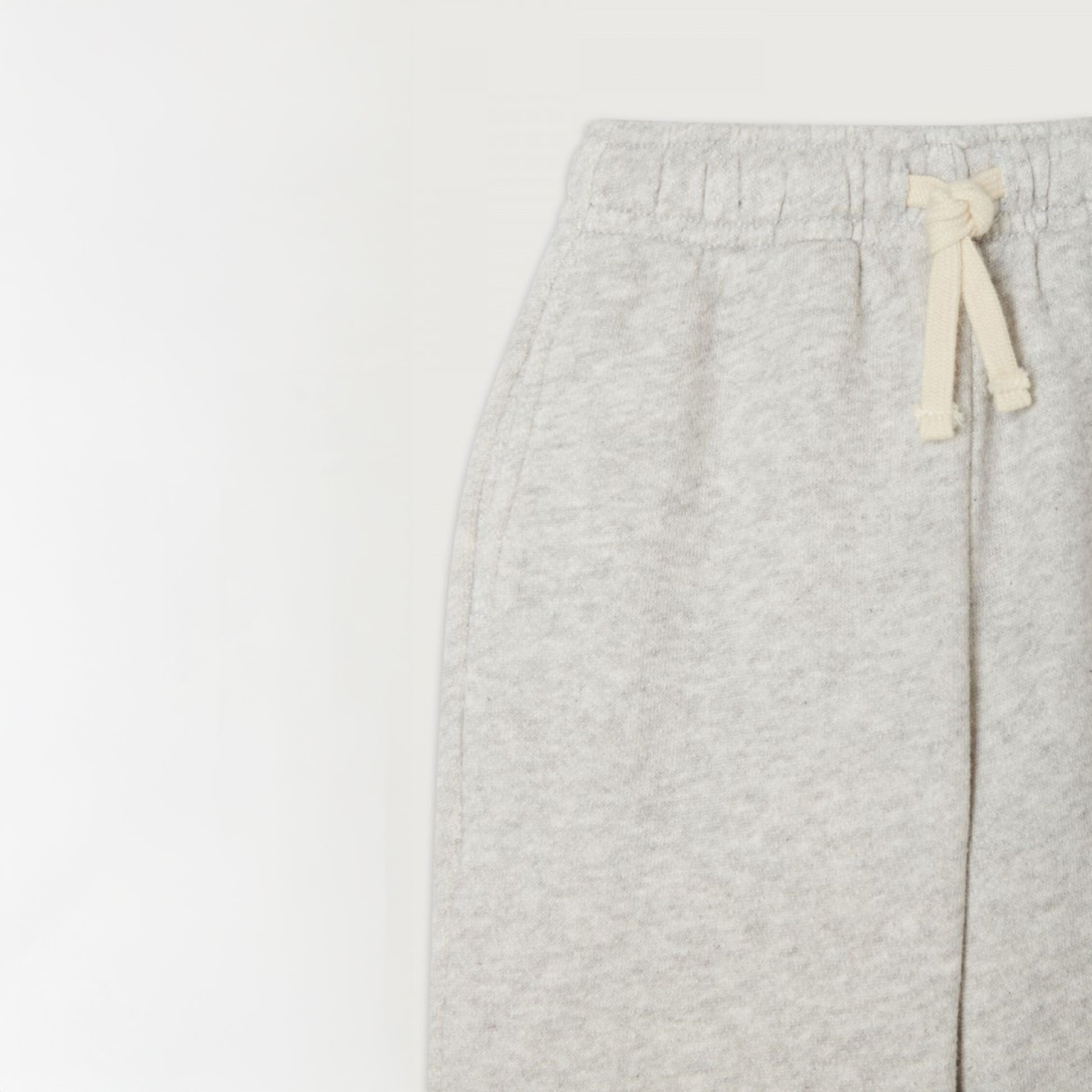 Close-up of the American Vintage Kids Grey Kodytown Joggers, highlighting the cream drawstring detail, soft fabric texture, and elasticated waistband.