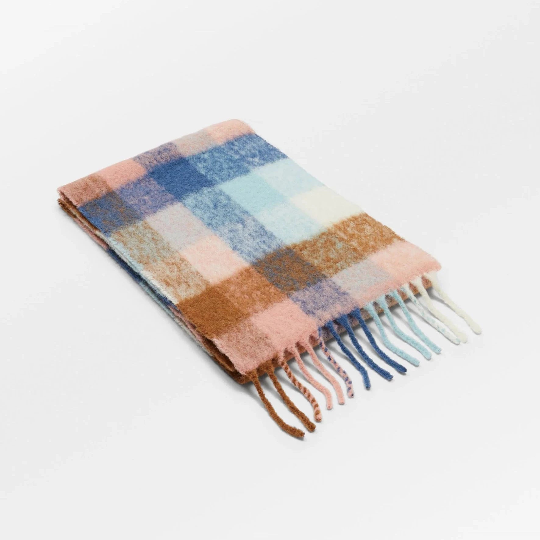 Plaid scarf with fringes on a white background