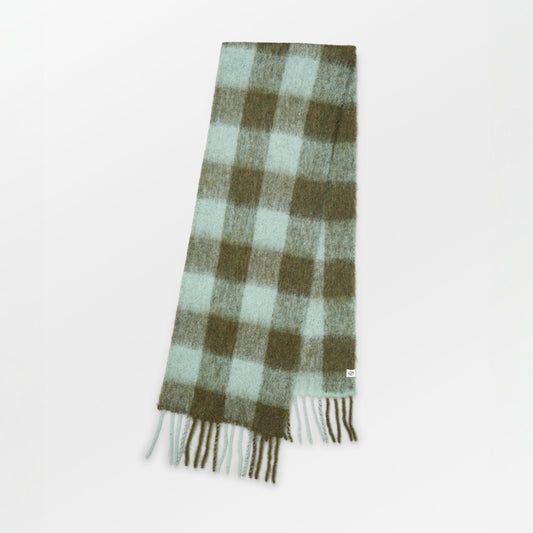 Becksöndergaard Sage Green Check Mincho Scarf featuring a classic checkered design in soft, earthy tones, crafted from luxurious Italian wool, draped elegantly on a neutral background.