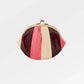 Color-blocked 'granny' style clutch purse with a gold clasp on a white background