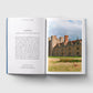 Open book showing a castle and a deer in a field on one page, with text on the other.