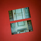 Two packaged chocolate bars with text and images on a red background