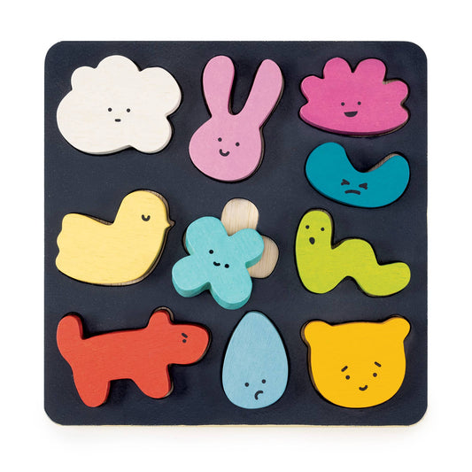 Colorful wooden puzzle with animal shapes on a black base