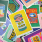 Collection of colourful product labels and packaging on a multicolored background