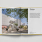 Open book showing a page with an image of a sculpture and text on a white background