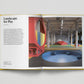 Open book showing a colourful indoor play area with text on the left page.