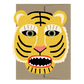 Card with a stylized tiger face design on a beige background