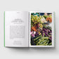 Open book showing text on one page and a colorful display of vegetables on the other, on a light gray background.
