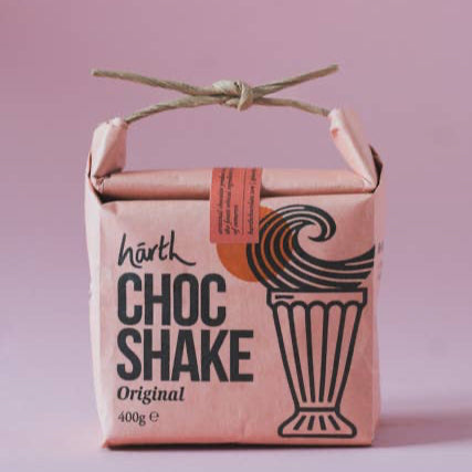 Harth Choc Shake packaging on a pink background