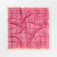 Pink checkered fabric on a white background