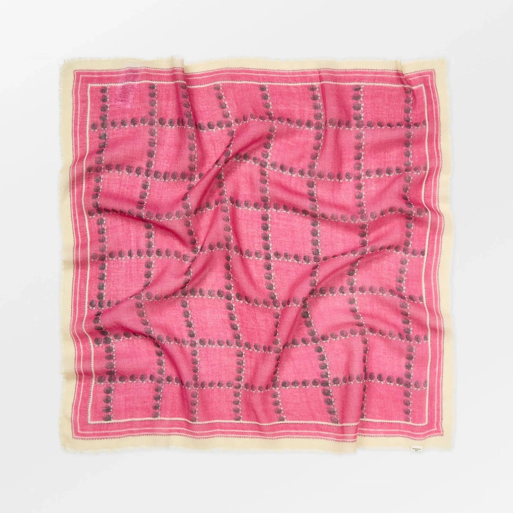 Pink checkered fabric on a white background