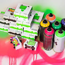 Colorful spray paint cans and boxes on a vibrant background