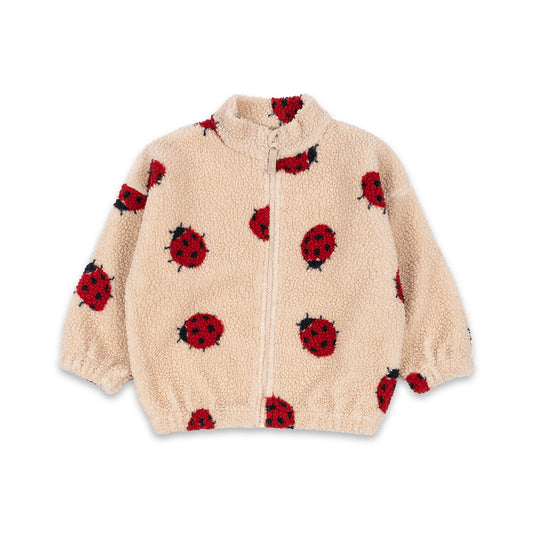 A Konges Sløjd fleece jacket in a soft cream colour, featuring a playful ladybird print. The zip-up jacket is made from cosy sherpa fleece and is adorned with scattered red and black ladybirds. Designed with elasticated cuffs and hem for a snug fit, it’s a warm and whimsical outerwear choice for little ones.