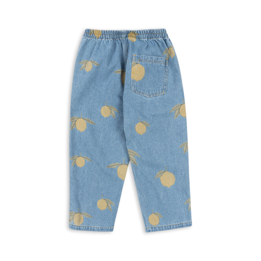 he Konges Sløjd Magot Pants in Lemon Denim, featuring an all-over lemon print on soft-washed denim. A vintage-inspired staple with a relaxed fit and an easy elastic waistband.