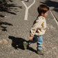 A little adventurer on the move in soft blue denim covered in playful lemons, layered with a snug teddy fleece and sturdy wellies. A perfect mix of cosy and cool.