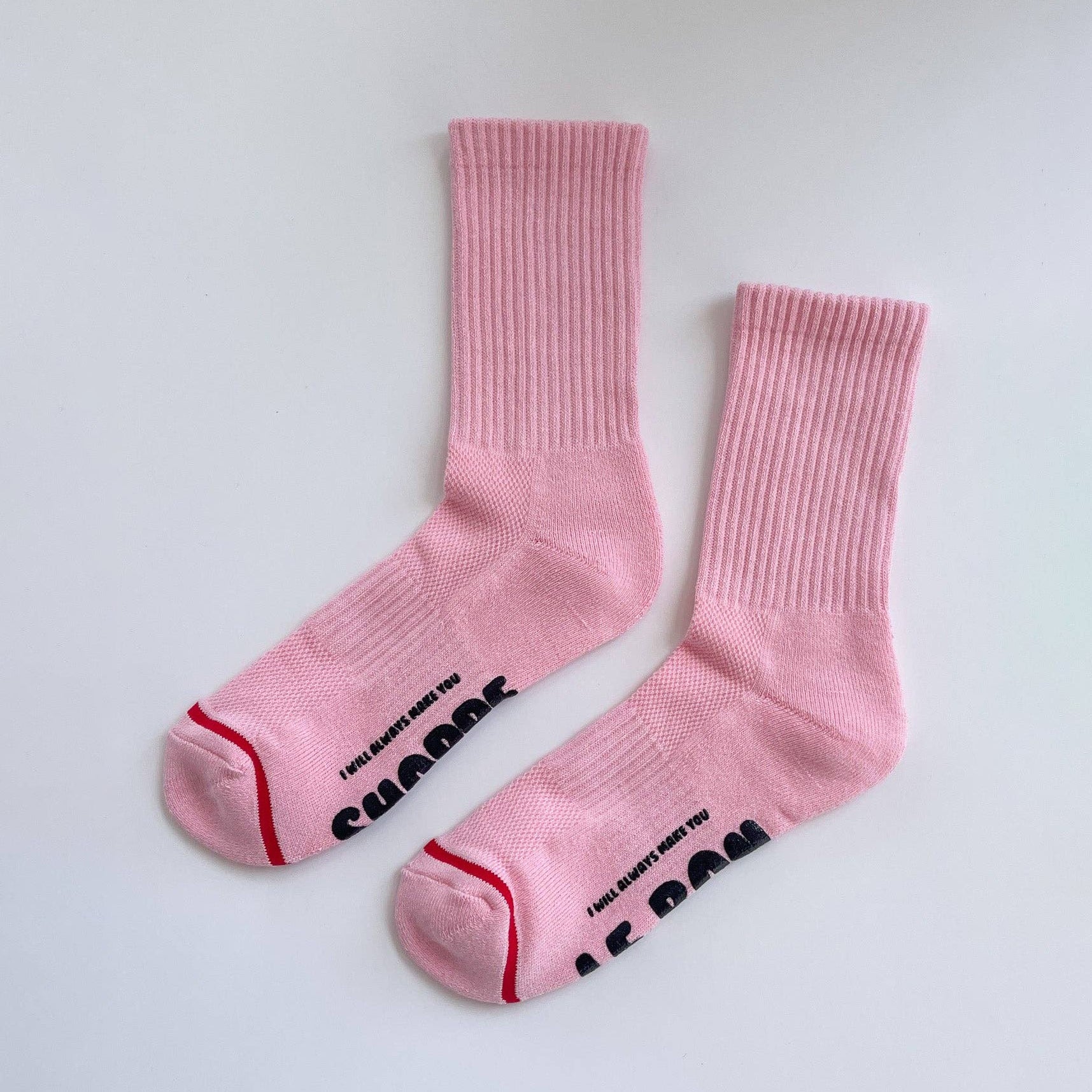Pink socks with text on a white background