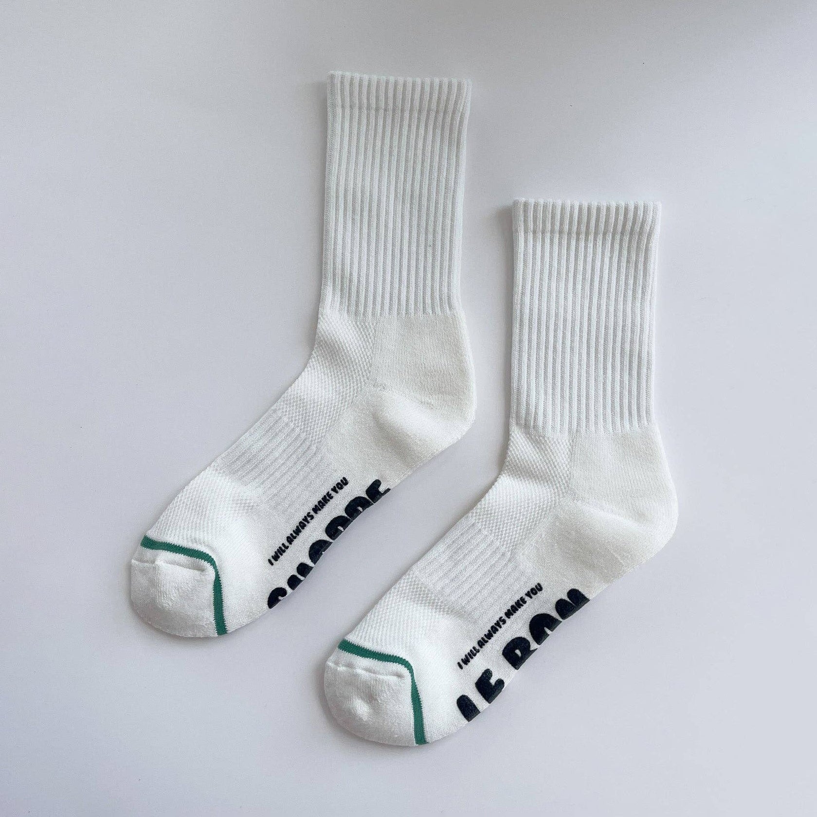 White socks with text on a light gray background