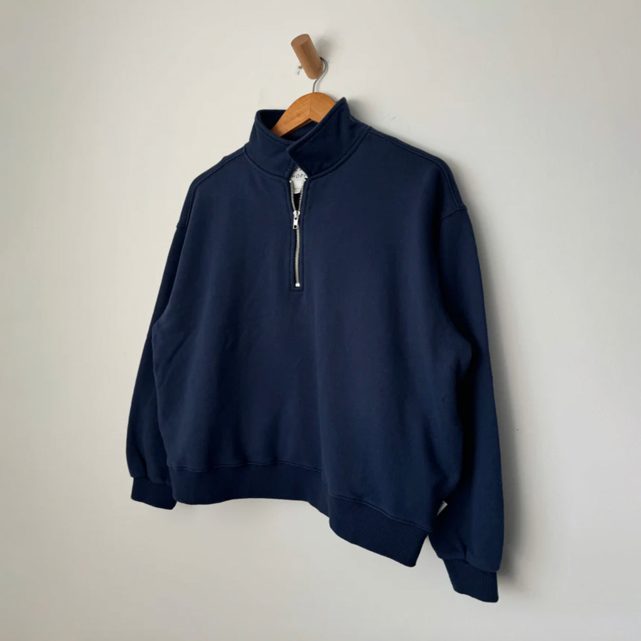 Vintage-inspired Noah Top with a soft interior and boxy fit, designed for layering. It includes a retro half-zip mock neck and practical side seam pockets.