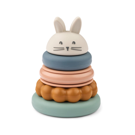 Stacking colorful toy with a rabbit-shaped top on a white background