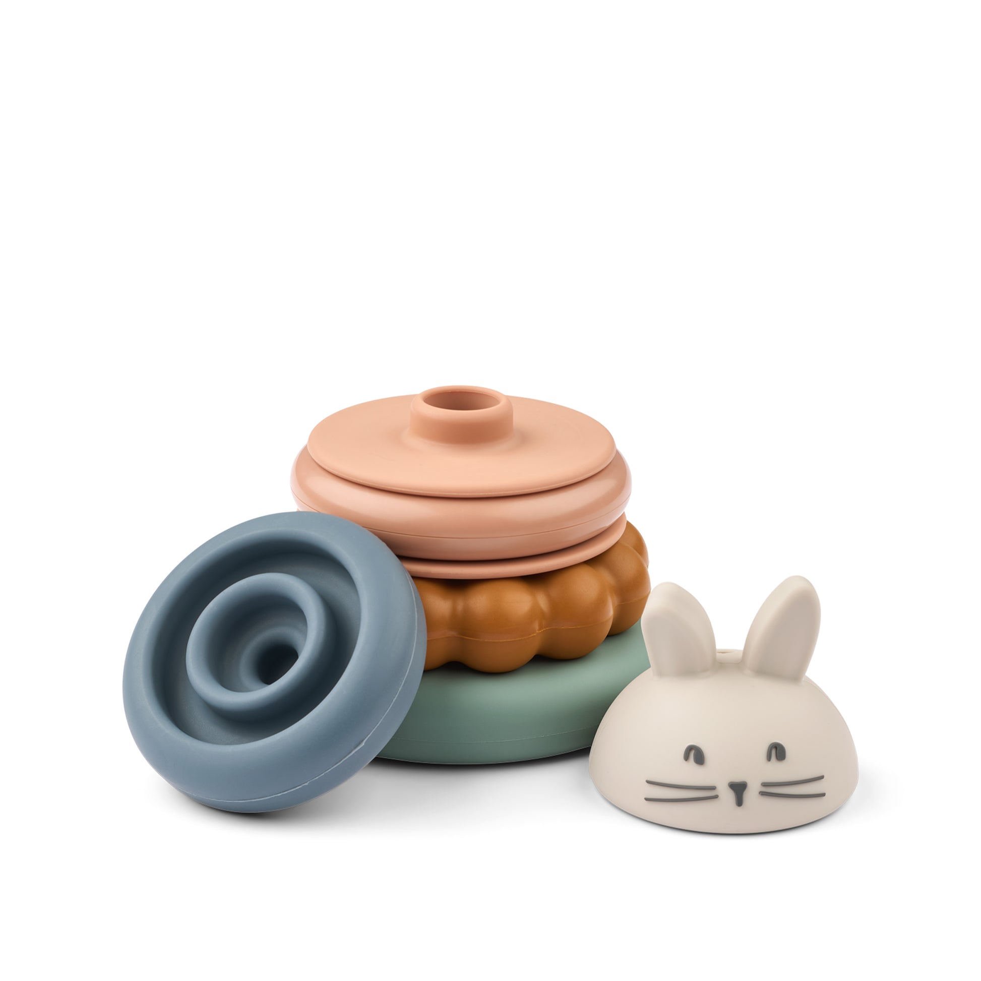 Pieces of a colourful stacking toy on a white background