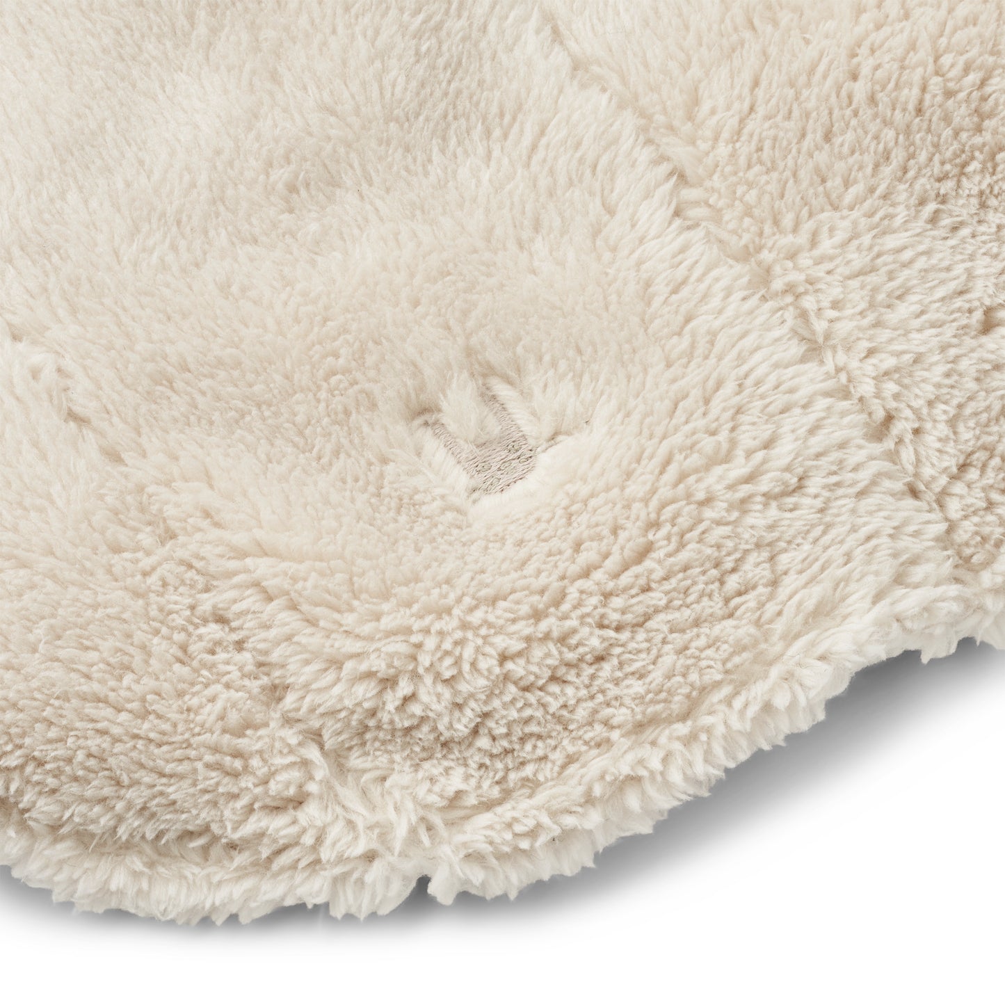 Close-up of a textured cream balaclava on a white background