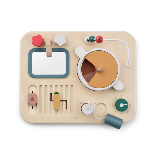 Wooden kitchen toy with various shapes on a beige background