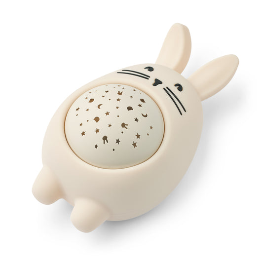 Cute rabbit night light with star pattern on a white background
