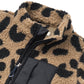 Close-up of a leopard print onesie with a black zipper on a white background