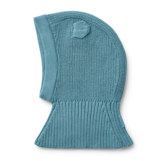Teal knitted balaclava on a white background
