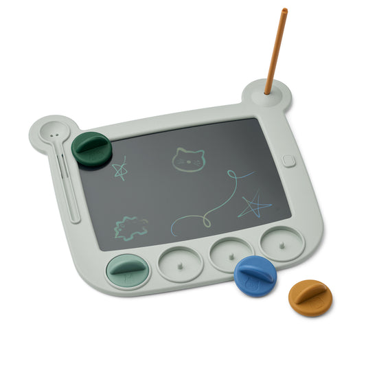 Children's drawing board with colorful magnets on a white background