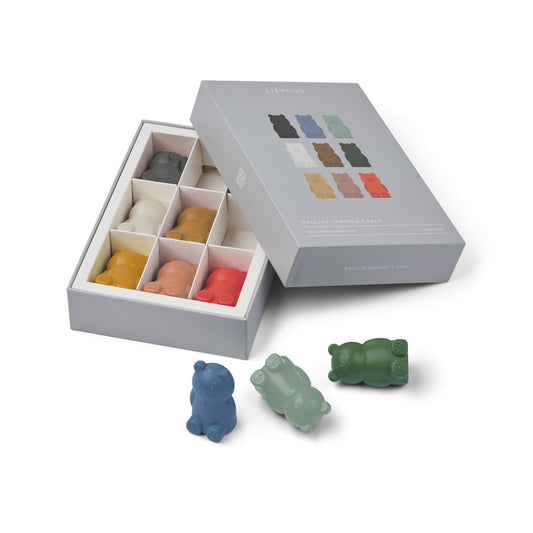 Bear-shaped color crayons in a box on a white background
