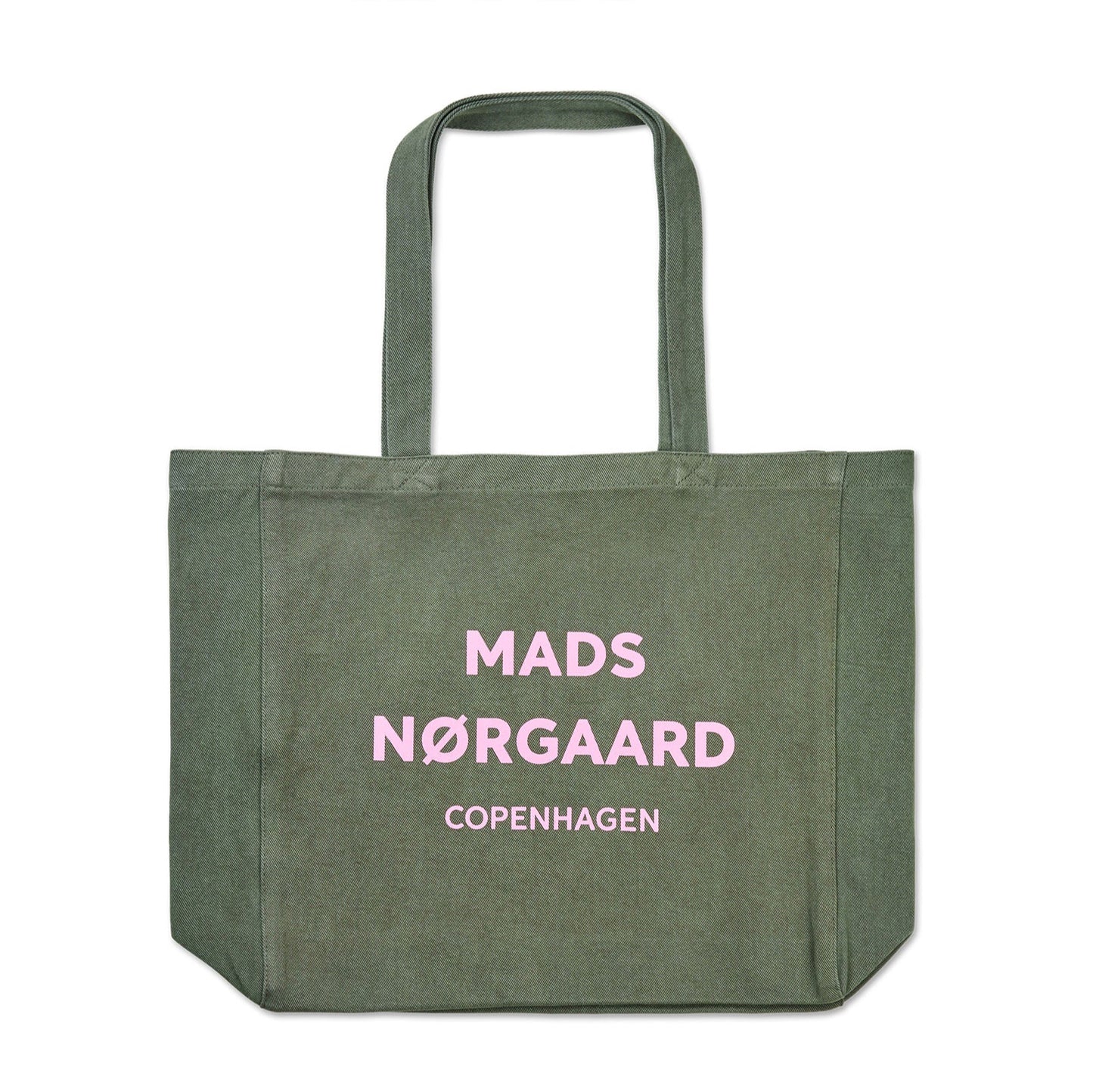 Green tote bag with 'Mads Nérgaard Copenhagen' pink text on a white background